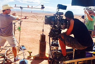 People filming movie in desert